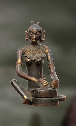 Bhujambu:Grinding of wheat