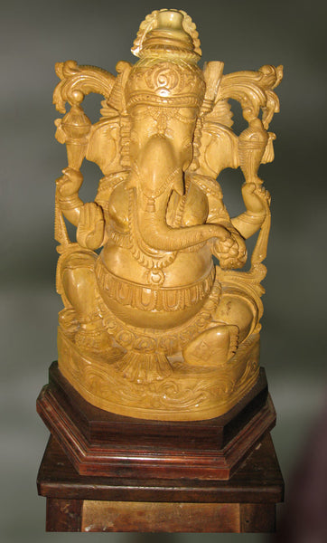 Wood sculpture of Ganesha blessing