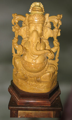Wood sculpture of Ganesha blessing