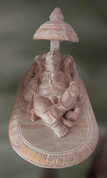 Vigneswara:  In a Reclined Position under a Canopy