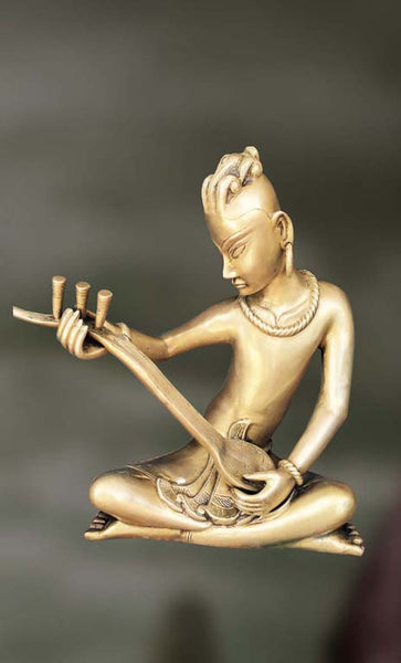 Brass Sculpture of man playing veena 