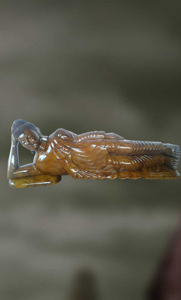 Wood sculpture of Lord Buddha in Nirvana