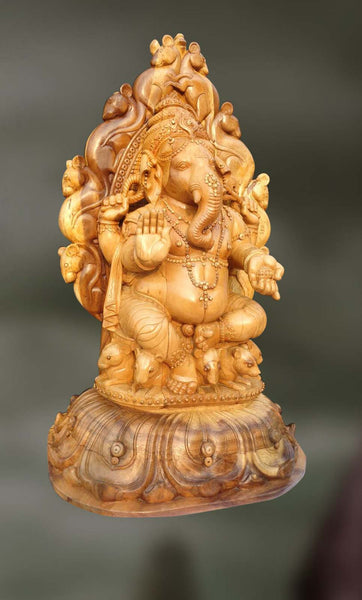 Wood sculpture of Ganesha with trunk turning left