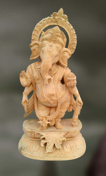 Wood sculpture of Ganesha with trunk turning left