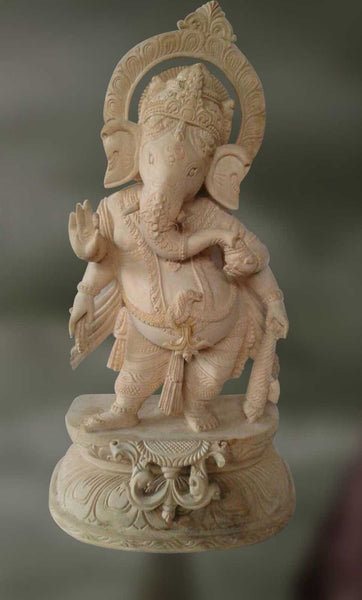 Wood sculpture of Ganesha blessing