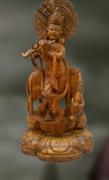 Wood sculpture of Lord Krishna playing flute