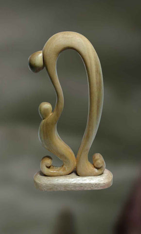 Wood sculpture of father and child
